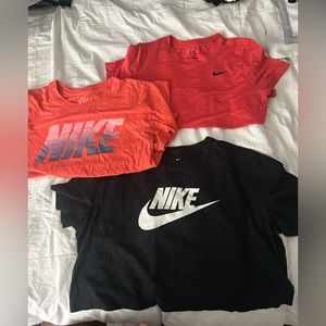 3 Nike T-shirts (Black = cropped, Pink w Black sign = Dri-fit, Coral = regular)